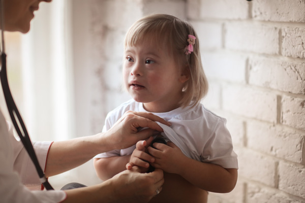 Photo: Child with Doctor using stethoscope