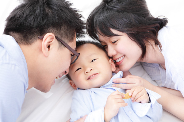 Photo of parents hugging child